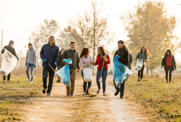 a group of people cleaning up a park