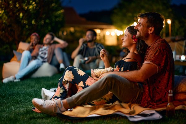 happy couple at an outdoor movie night