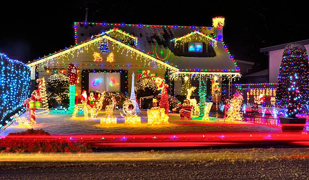 A house covered in snow with holiday lights