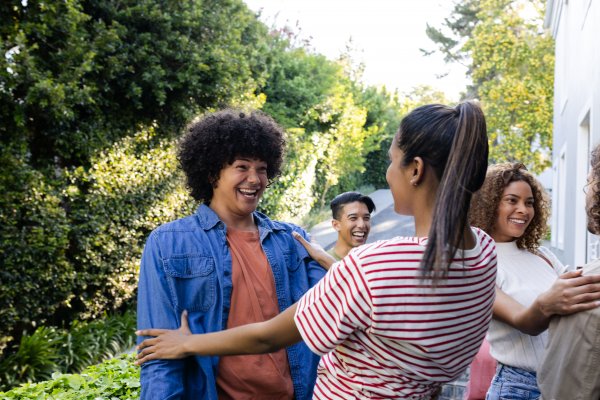 women laughing and embracing