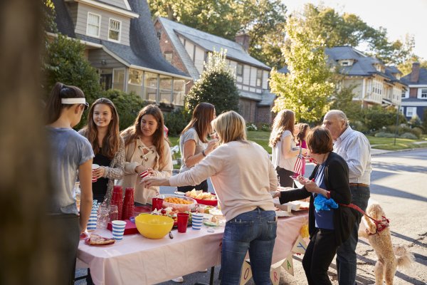 community event, people gathered around a table with food