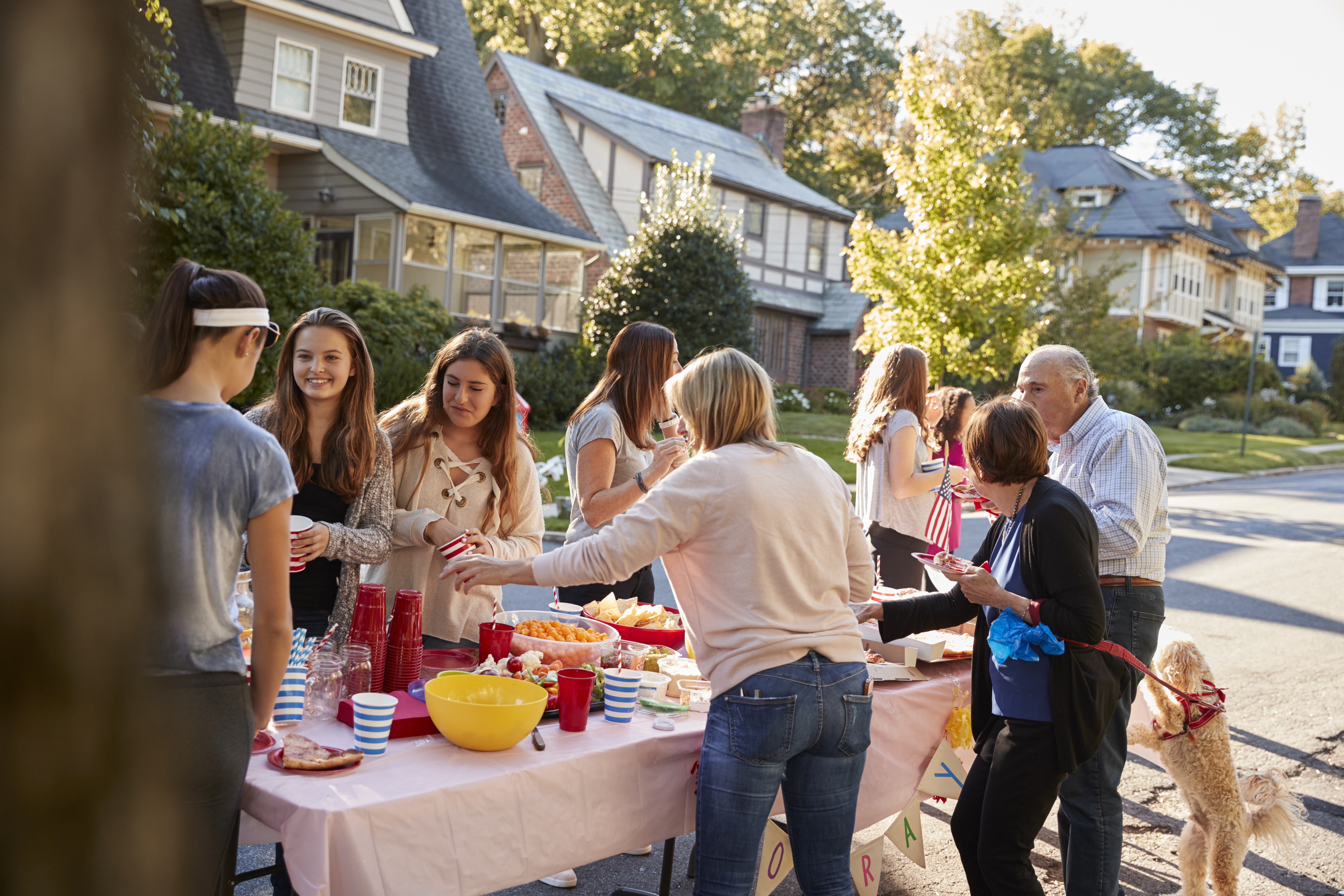 community event, people gathered around a table with food