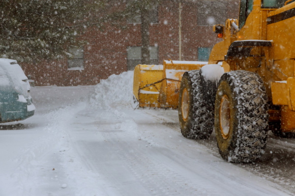 snow plow moving snow on street