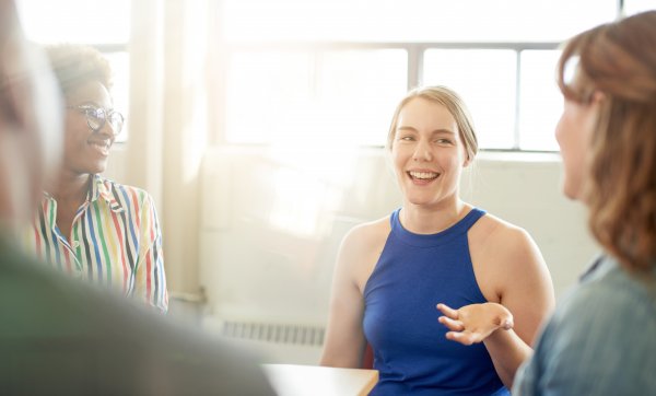 group of people talking and smiling