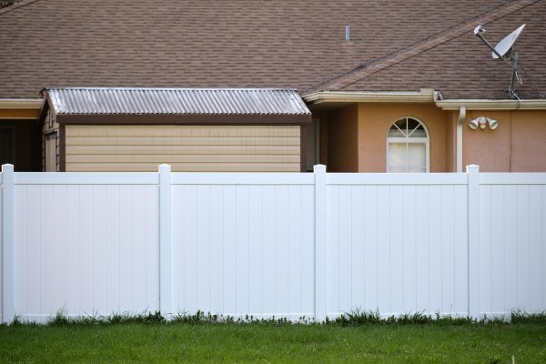 white fence in a backyard